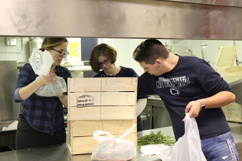 Employees packing food into bags