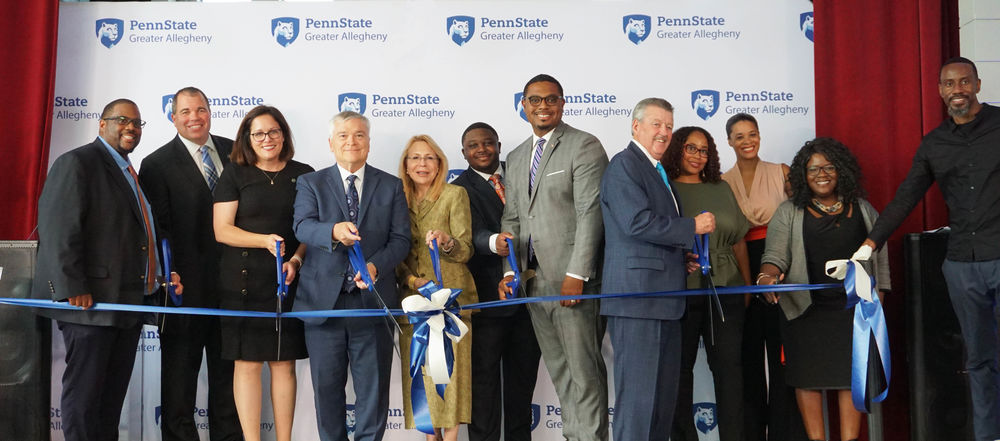 people cutting a ribbon