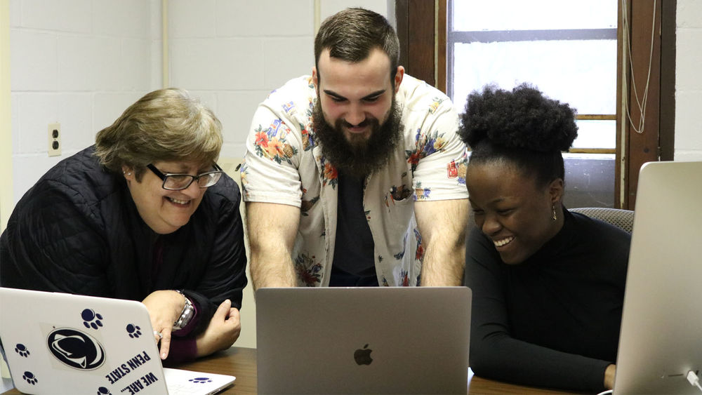 Three students collaborating on Pittsburgh Literature Project