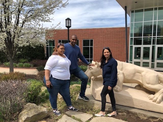 Photo of Short family at lion shrine at Greater Allegheny