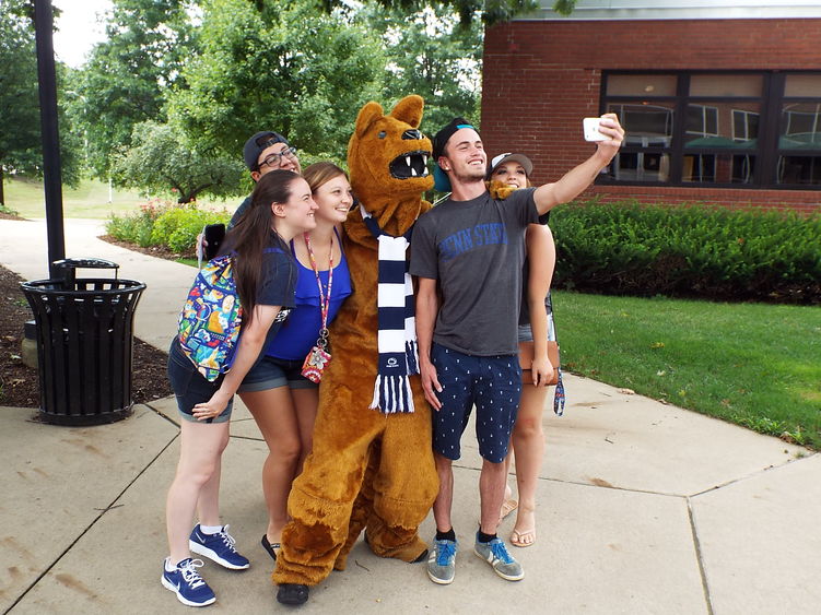 group of students with lion group of students with lion