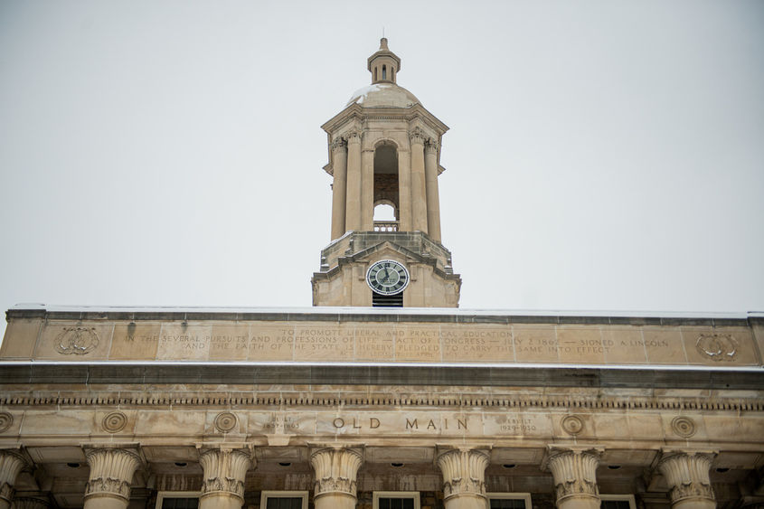 Tower of campus building with grey skies in background.