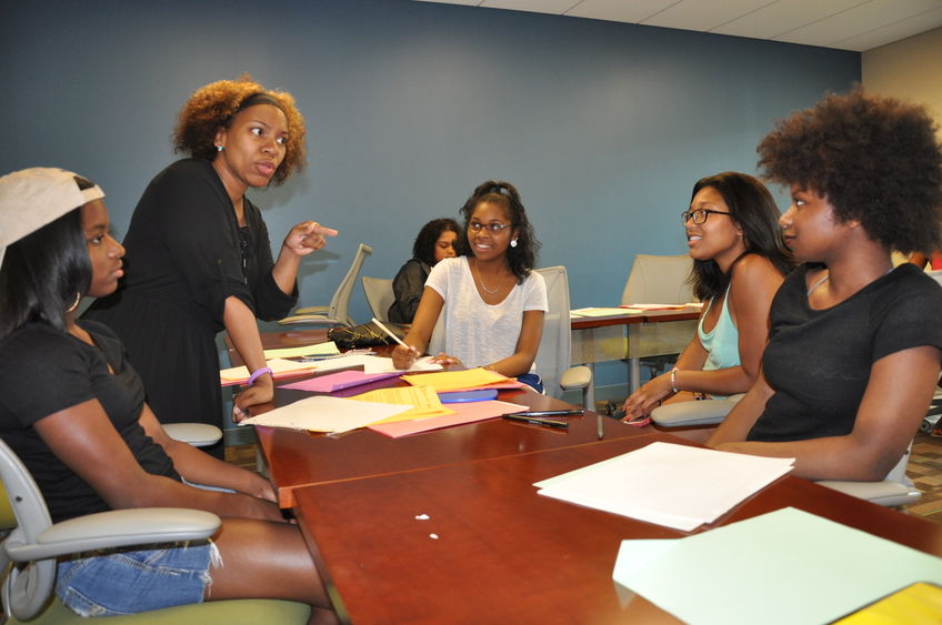 woman talking to students